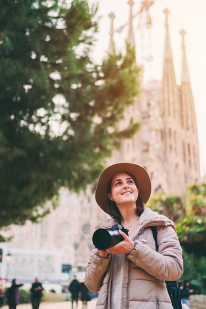 istock Tourist woman with camera exploring Bracelona 1455781626