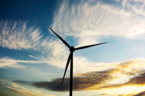 Beautiful sunset above the wind turbine