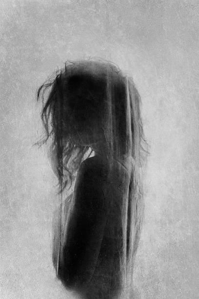 istock Faceless woman behind the curtain 1455783437