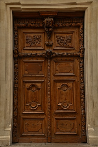 A view of an intricately carved wooden door in the French city of Lyon.