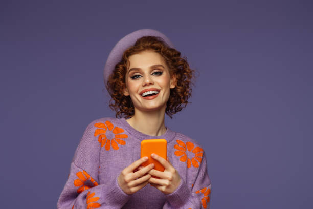 istock Beautiful emotional woman using smartphone 1455787937