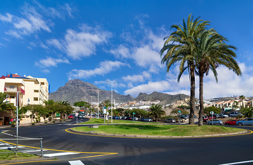 Costa Adeje, Tenerife, Spaine - February 6, 2019: One of the streets of Costa Adeje, the road in the  popular  resort in southern coast of the island, Canary Islands.