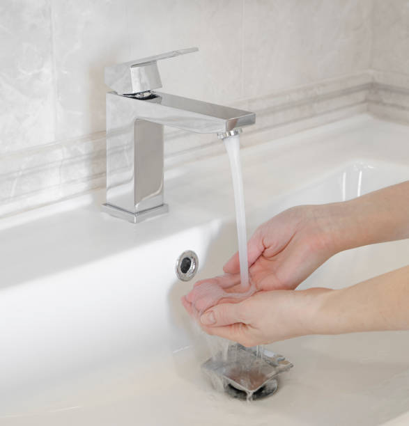 istock Girl washing her hands 1455794044