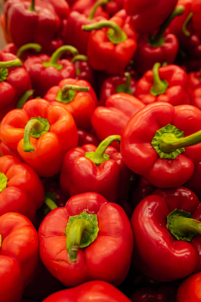 istock Big pile of red peppers in a store. 1455804492