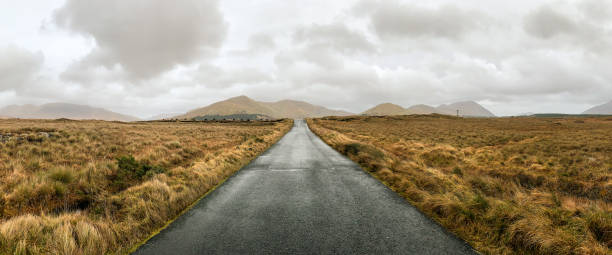 Connemara Quiet road in the Connemara region connemara national park stock pictures, royalty-free photos & images