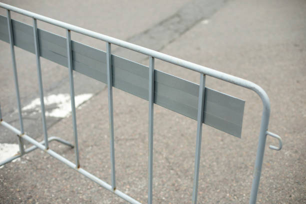 istock Fence on road. Fenced place. Pit on road behind fence. Patch on asphalt. 1455812846