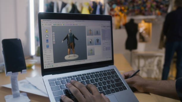 istock Designer creates 3D clothes on laptop in atelier 1455816494