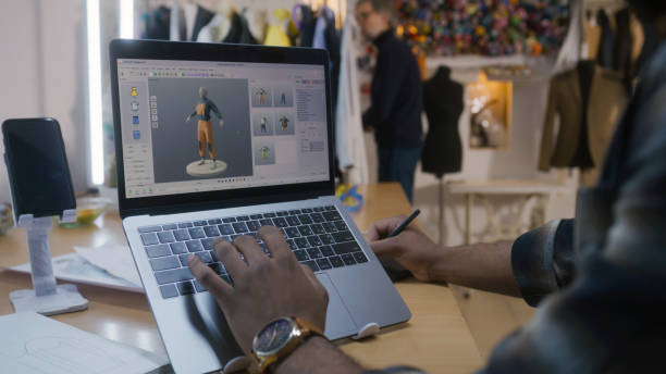 istock Designer creates 3D clothes on laptop in atelier 1455816502