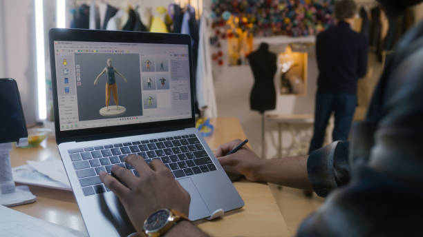 istock Designer creates 3D clothes on laptop in atelier 1455816504