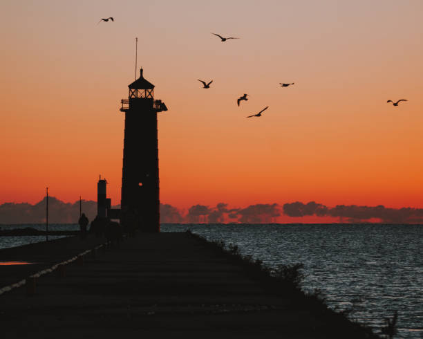 istock Beautiful view of a lighthouse against scenic sunset 1455817906