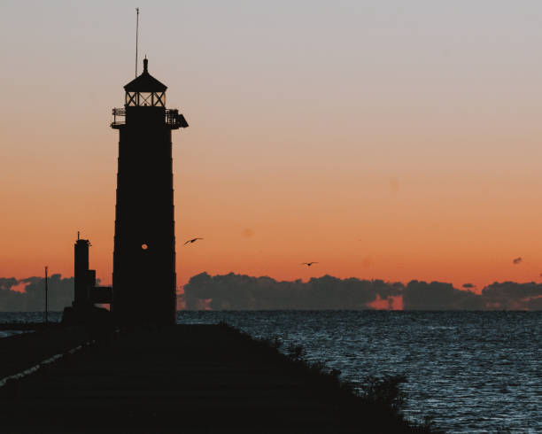 istock Beautiful view of a lighthouse against scenic sunset 1455818212
