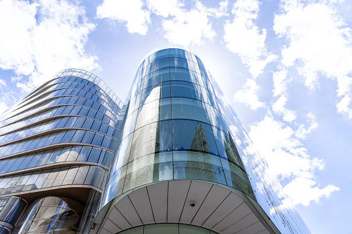 Low angle view of modern glass office buildings, background with copy space, full frame horizontal composition, Broadway Sydney Australia