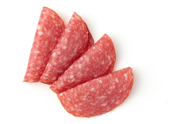 istock salami sausage cut into pieces isolated on white 1455825258