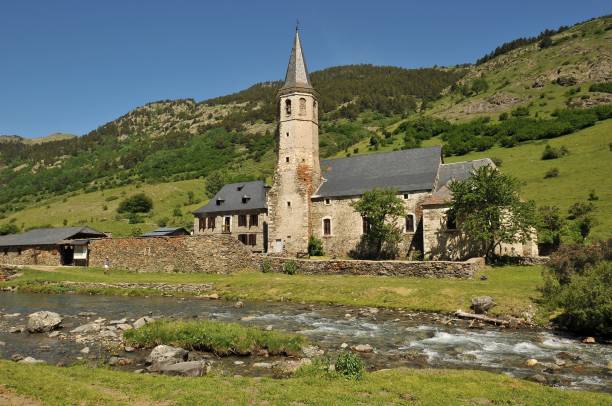 istock River running through a lush green forest with a small church in the background 1455825918