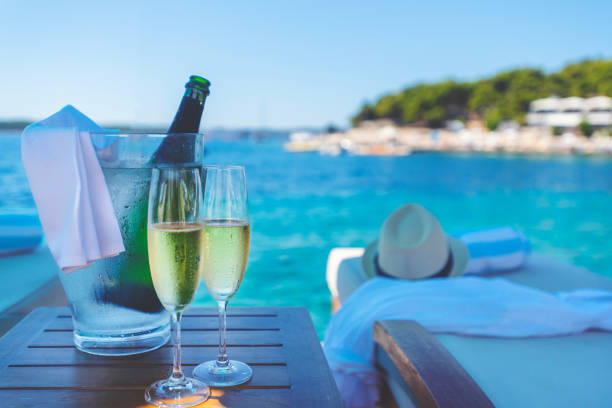 istock Champagne for two at the waterfront beach. 1455826978