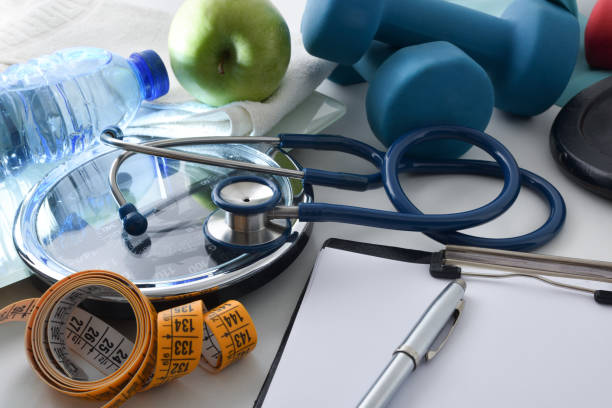 istock Physiotherapist workbench with stethoscope notepad and tools for sports 1455827176