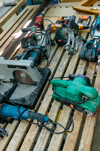 Photo of a Tools in Carpentry Repair Shop Lying on a Workbench.
