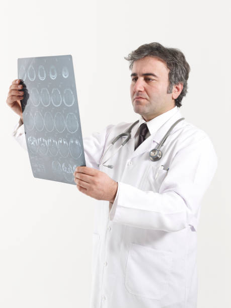 istock Doctor looks at brain scan images 1455828001