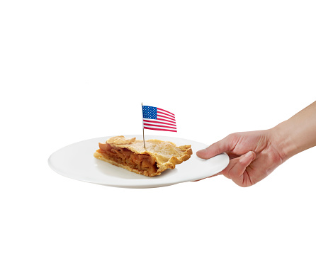 Waiter serving apple pie in a plate