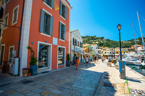 13 June 2022, The Paxos Island, Greece, Gaios beautiful cozy town, buildings, streets, doors, architecture, exteriors, flowers, balconies in summer