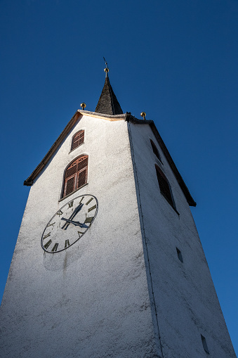 a churchtower with blue sky