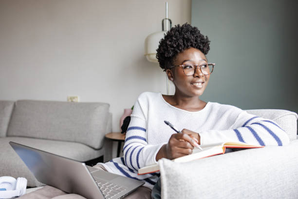 istock A young African-American woman using a laptop 1455833842