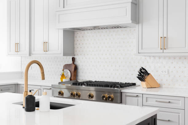 istock A kitchen detail with grey cabinets and a tiled backsplash. 1455836065