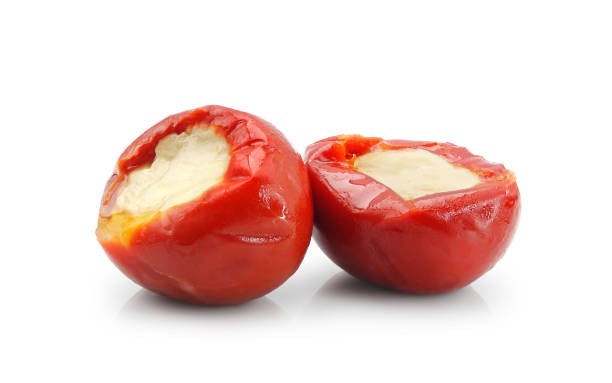 Cheese stuffed two cherry pepper isolated on white stock photo