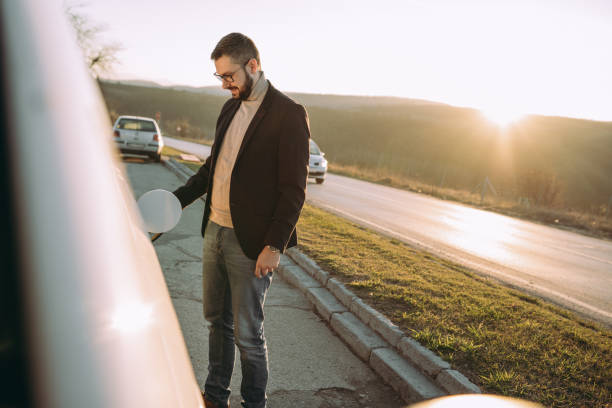 istock Businessman at the gas station 1455836313