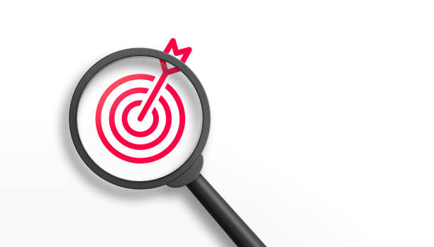istock Red dartboard inside of black magnifier glass on white background for setup objective target and business goal concept. 3d illustration. 1455849503