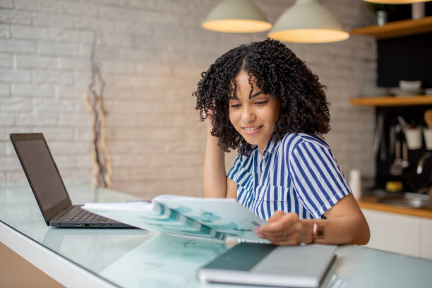 istock Young woman working from home 1455849717