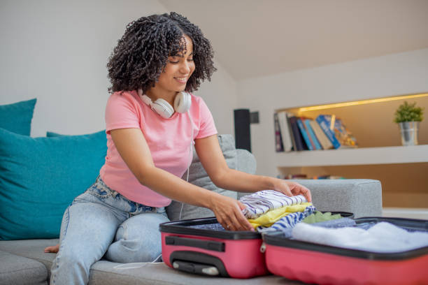 istock Woman organizing her luggage 1455849769