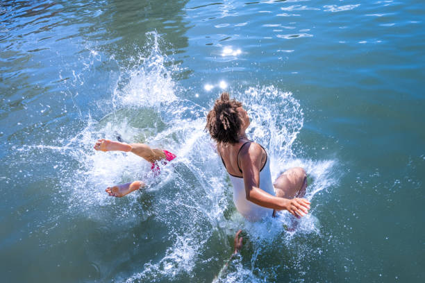 istock Friends landing into the lake 1455849965