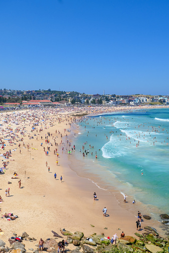 Bondi Beach in the Eastern Suburbs of Sydney on Christmas Day 2022.  This image was taken from the southern end of the beach looking north in the early afternoon.