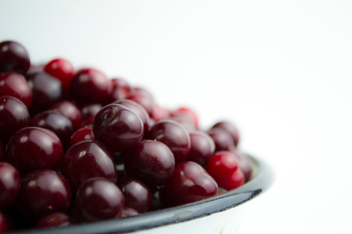 Cherry on a white background, juicy cherry for a photo wallpaper in your kitchen. High quality photo