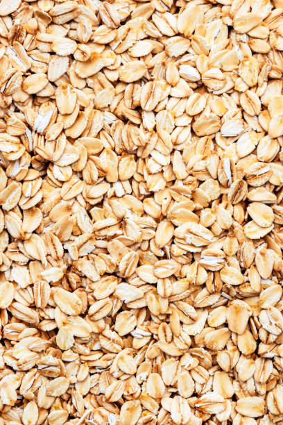 istock Raw organic oatmeal, food background texture, top view 1455853313