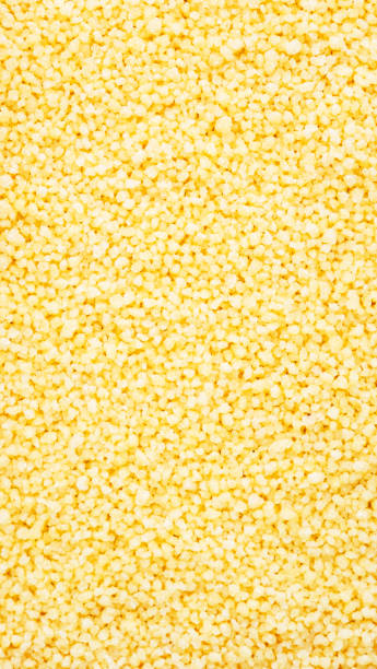 istock Couscous, dry wheat grain, food background texture, top view vertical banner 1455853328