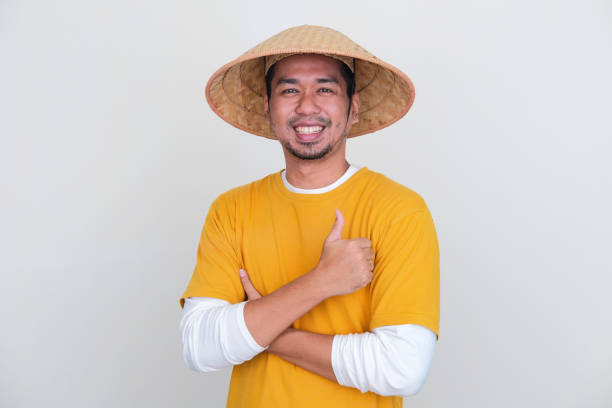 istock Young Asian farmer smiling happy and give thumb up 1455864979