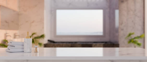 istock Mockup space on elegance white marble tabletop over blurred background of luxury bathroom 1455878152