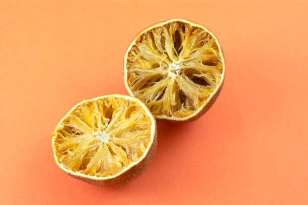 istock Dried out inedible spoiled oranges on orange 1455879562