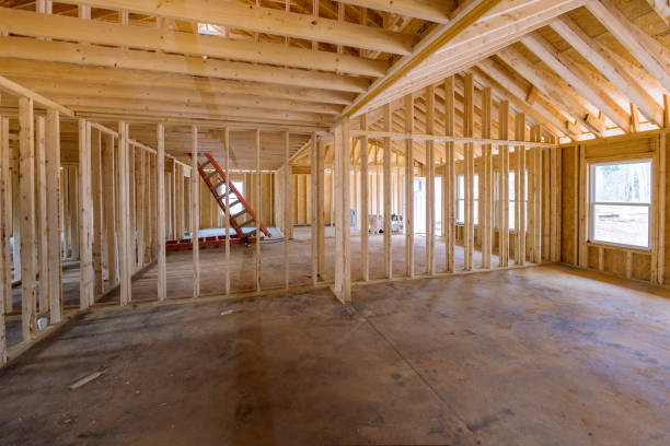 istock The interior framing of a new house that is under construction, framework truss beams frame system installed in the new house 1455881660