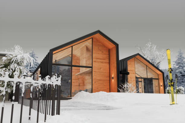 luxury villa exterior with pair of skis and sticks on snowy garden - winter chalet snow residential structure imagens e fotografias de stock