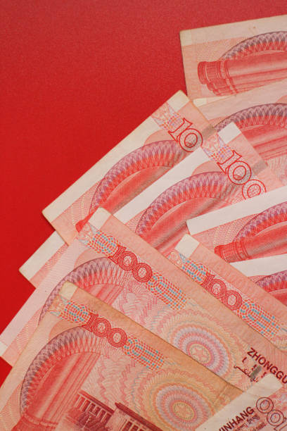 Chinese Money on red Background Mixed Chinese Money , Renminbi, on red background mao original stock pictures, royalty-free photos & images