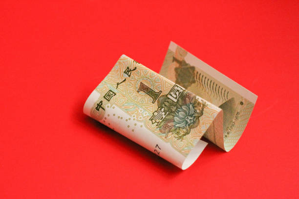 Chinese Money on red Background Mixed Chinese Money , Renminbi, on red background mao original stock pictures, royalty-free photos & images