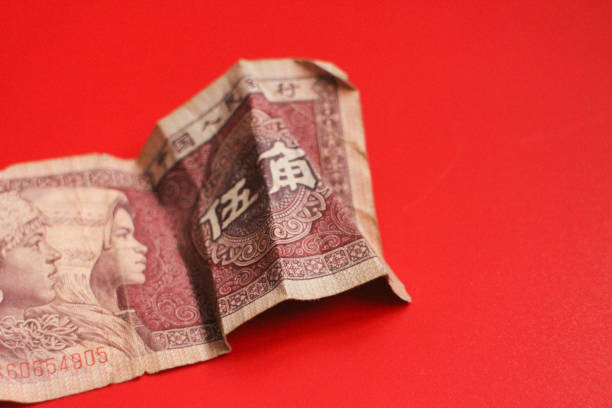 Chinese Money on red Background Mixed Chinese Money , Renminbi, on red background mao original stock pictures, royalty-free photos & images