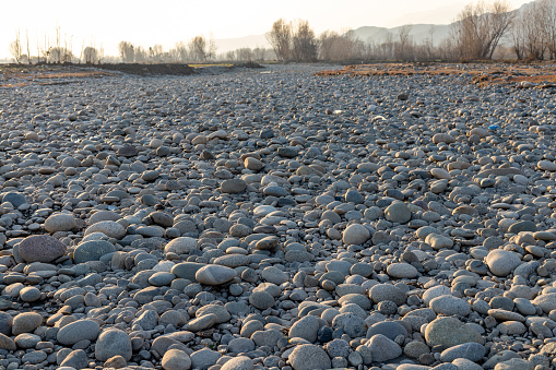 Dry river pebbles and stones in the winter