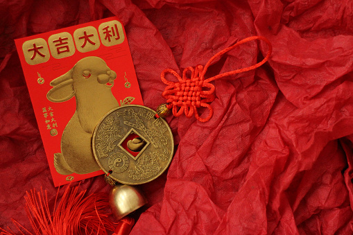 Chinese Ingot and the Lucky Red Envelope with the Script in Chinese, Good Luck