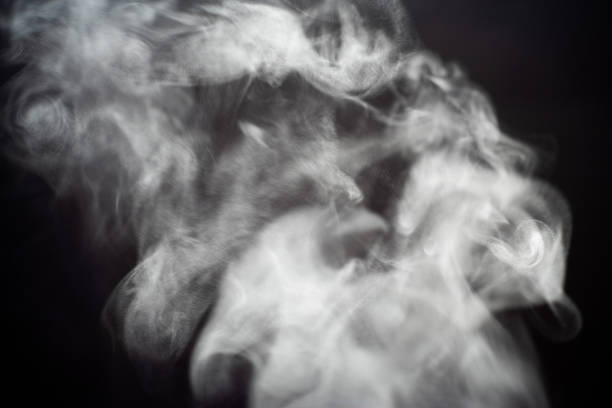 Smoke from a fragrant stick on a gray background.