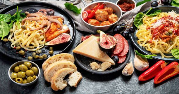 istock Dinner table of italian meals dishes. 1455890342