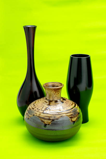 istock set black antique ceramic vase. empty decorative ceramic pot on green background. brown modern porcelain vase for room interior. vintage handmade glaze pottery flowerpot office decoration collection 1455890619